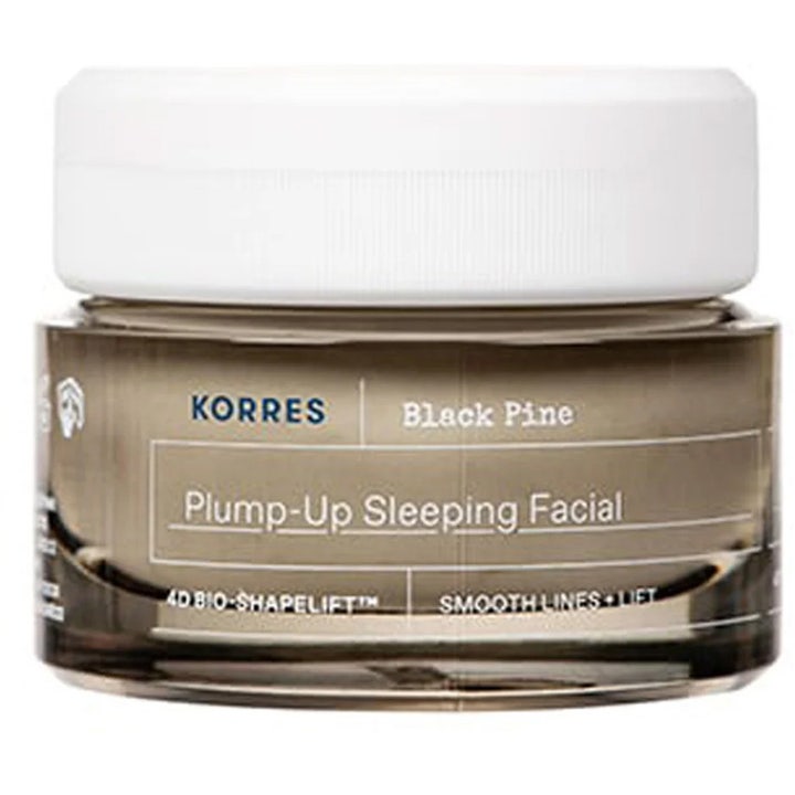Korres Black Pine Plump-Up Sleeping Facial opstrammende natcreme i en mørk glaskrukke med hvidt skruelåg