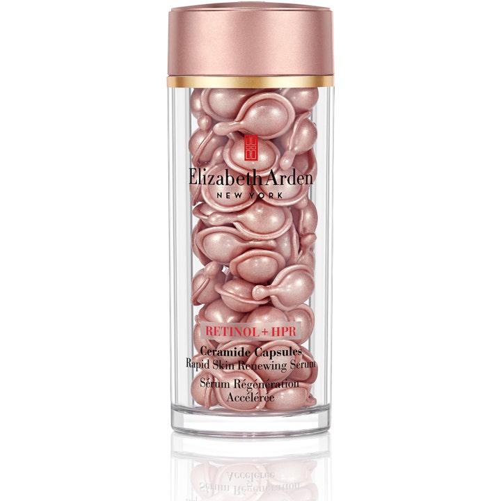 Elizabeth Arden Retinol + HPR Ceramide Capsules fornyende serum med rosa perlemorskapsler i klar krukke med rosaguld låg