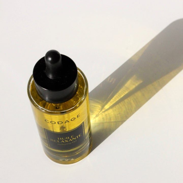 Codage Paris Relaxing Oil 100 ml beroligende kropsolie i glasflaske med sort pipette og lang skygge