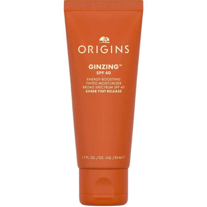 Origins GinZing SPF 40 Tinted Moisturizer 50 ml fugtgivende dagcreme i en klar orange tube med hvidt låg