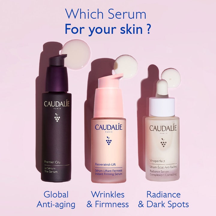 Caudalie Resveratrol-Lift 30 ml opstrammende serum mod rynker i lyserød pumpeflaske vist sammen med andre sera.