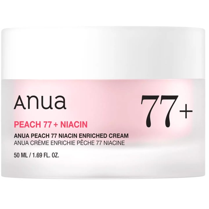 Anua Peach 77 Niacin Enriched Cream 50 ml giver glød i en frostet glaskrukke med hvidt låg og lyserødt skær